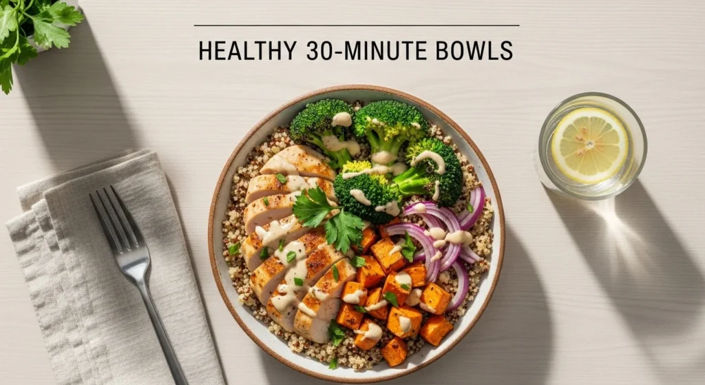 Grain bowl with chicken, quinoa, and roasted vegetables.